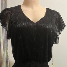 100% Polyester Machine Wash V-Neck Long To The Knee Summer Cocktail V-neck Top, Chic V-neck Top For Cocktail, Elegant V-neck Blouse For Party Season, Glamorous V-neck Cocktail Tops, Glamorous V-neck Dress With Rhinestone Fringe, V-neck Party Dress With Beaded Fringe, Amara Dress, Casual V-neck Dress With Fringe, Betsey Johnson Dress