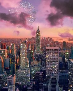 an aerial view of the city at night with fireworks in the sky and skyscrapers lit up