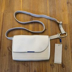 New With Tag Rothy’s Belt Bag White Clutch Flap Bag With Dust Bag, White Flap Bag For Travel With Dust Bag, White Leather Shoulder Bag With Magnetic Closure, White Top Handle Shoulder Bag With Magnetic Closure, White Crossbody Shoulder Bag With Magnetic Closure, White Textured Leather Crossbody Shoulder Bag, White Rectangular Shoulder Bag With Magnetic Closure, White Textured Leather Travel Bags, Chic White Rectangular Belt Bag