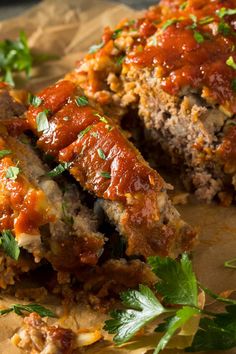 the meatloaf is covered with sauce and garnished with parsley