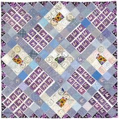 a blue and purple patchwork quilt with sunflowers on it