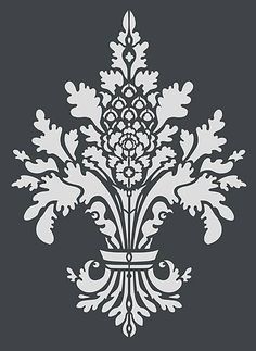 a white and gray wallpaper with an ornate design on the bottom half of it