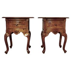 two wooden nightstands with one drawer open and the other closed on both sides, sitting side by side