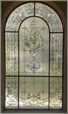 a stained glass window with an ornate design