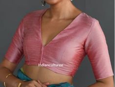 Rose pink solid saree blouse has a V-neck, short sleeves, and a stylized front with front hook and eye closure Fabric:  Pure  Silk Readymade Saree blouse Front open - without pads Princess cut Soft, light-weight and breathable fabric. If you could include following info in the note to whenever you placed the order, you will get best-matched blouse * Chest size: * Waist size: * Blouse Length: * Sleeve Loose: * Sleeve Length: * Front Neck length: * Back-Neck length: We usually ship within 3-5 working days after receiving clear payment, We deliver worldwide Kindly contact us for any queries, we are here to help you Wash Instruction: Dry Clean Only We undertake custom orders on any designs and fabrics in required sizes We ensure that every purchase you make brings satisfaction to you Thanks fo Blouse Front Hook Design, Blouse Design For Pink Saree, Front Hook Blouse Designs Latest, Back And Front Blouse Design, Soft Silk Sarees Blouse Designs, Blouse Designs Latest V Neck, V Blouse Design, V Neck Blouse Designs Saree, Blouse Back And Front Neck Designs