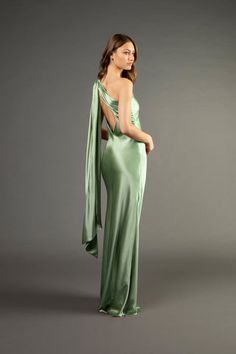 a woman in a long green dress