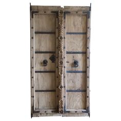 two wooden doors with metal handles on each side