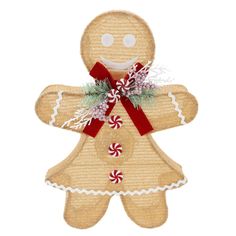 a gingerbread man ornament with candy canes on it's side