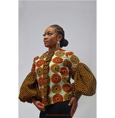 The African wax puffed top is made from top quality 100% cotton wax fabrics. It has puffy sleeves for a sleek and modern look. It is comfortable to wear and can be paired with different types of pants or skirts to create different looks. This top is also ideal for formal and casual occasions. Round neckline Puffy long sleeves Elastic at the wrists Zipper on the back Semi-fitted cut COMPOSITION 100% cotton MAINTENANCE Wash in cold water by hand or machine Wringing and suspending to dry Dry cleani African Print Tops Blouses, African Print Tops For Women, African Print Skirt Ankara Styles, Different Types Of Pants, Dope Fashion Outfits, Puffy Long Sleeves