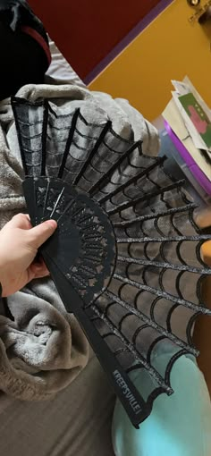 Spiderweb Fan Description This witchy hand fan is the perfect creepy accessory to your vintage wardrobe! The fan is made of lace and has scalloped edges to look just like a spider web. The base is made of plastic with gothic details. The black tassel measures approximately 3" and hangs approximately 3". The fan measures approximately 17" when open and 9" when closed. Stay spooky in style all year round. Great for cosplay or any costume accessory! This Witchy Hand Fan is the Perfect Creepy Access Victorian Gothic Halloween, Spider Web Corset, Gothic Spider, Creepy Accessories, Gothic Sewing, Spider Web Jewelry, Aesthetic Fan, Spooky Accessories, Gothic Things