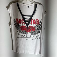 Rock It Out With This New Rock Star Free Spirit Sleeveless V T Top With Cross Cross. You Will Receive The White Item I Photographed Not The Similar One On Model. White Rock And Roll Tops For Summer, Rock And Roll Style Tops For Summer Music Festival, Edgy Tank Top For Spring Concert, White Rock And Roll Top For Summer, White Rock And Roll Summer Tops, White Rock And Roll Summer Top, Rocker Style Tops For Spring Concerts, Rebellious Spring Tops For Concerts, Chiffon Tunic Top