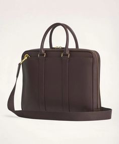 The perfect size to bring to the office and on the plane, our briefcase boasts a classic smooth, full grain texture along with its gunmetal hardware, double-sided zipper, detachable shoulder strap, navy cotton twill lining and every pocket you need to get from point A to point Z..15 ¾ X 12 X 2' Gusset 5½' handle drop..100% leather.Imported.The perfect size to bring to the office and on the plane, our briefcase boasts a classic smooth, full grain texture along with its gunmetal hardware, double-s Brown Briefcase With Gold-tone Hardware For Work, Timeless Everyday Briefcase With Gold-tone Hardware, Timeless Briefcase With Gold-tone Hardware For Work, Classic Laptop Bag With Luggage Sleeve For Work, Brown Briefcase With Gold-tone Hardware For Business, Brown Business Briefcase With Gold-tone Hardware, Business Bags With Gold-tone Hardware, Brown Briefcase With Gold-tone Hardware For Office, Classic Business Bags With Gold-tone Hardware