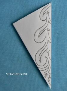 a white triangle with an intricate design on it's side and the word stavneg ru written in black ink