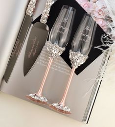 two champagne flutes are sitting next to each other