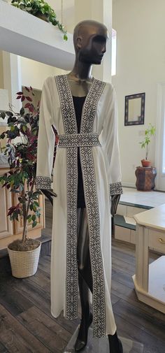 Basic information: White Chiffon Abaya / Kaftan / Thobe / Dress with Black Embroidery/Tatreez Modern Style with Embroidered / tatreez belt - Color : White & Black embroidery - Condition : NEW - Price : 65$ - size : 1 (Fits Small & Medium) Shoulders: 16" inches Sleeves Length: 24" Inches Abaya Length: 58" Inches - size : 2 (Fits Small & Medium) Shoulders: 16.5" inches Sleeves Length: 24" Inches Abaya Length: 58" Inches - Shipping : Free with USPS Priority Mail Shipping - No Returns & Exchange Acc Jordanian Dress, Arab Dresses, Dress Kaftan, Black Embroidery, Abaya Dress, Kitenge, Arab Women, White Chiffon, Dress Clothes For Women