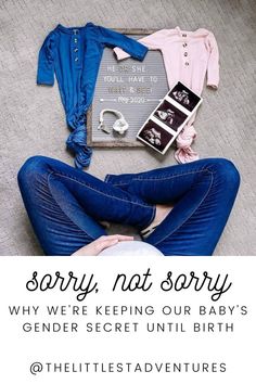 a woman laying on the floor with her feet up and wearing blue jeans, pink shirt and