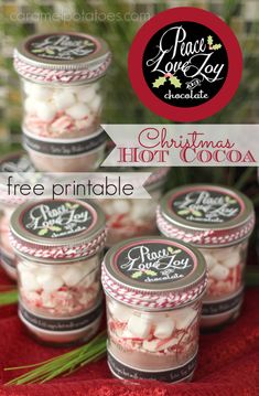 four jars filled with christmas hot cocoa