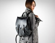 "This Artemis backpack is made out of cotton jeans with a black houndstooth pattern and black soft Italian cow leather. It is fully lined with a cotton fabric. A backpack that you can take everywhere. Perfect for daily use or during your travels. If you have a lot of gear to carry, this fits it all without being bulky. The regular size comfortably accommodates a 13\" laptop while the mini size fits a tablet and a water bottle nicely. You can use the three external zippered pockets, two small ones on the sides and one larger in the back for transportation cards, phones, passports, car keys, or anything you wish to have quick access to. Whenever a need for extra room, you can just leave the gusset open. It comes in two sizes to choose from. FEATURES * The flap secures with two sets of magnet Standard Backpack For Everyday Use In Fall, Trendy Travel Backpack For Winter, School Backpack With Adjustable Strap For Fall, Trendy Winter Travel Backpack, Fall School Backpack With Adjustable Strap, Everyday Fall Backpack, Standard Backpack For School In Fall, Black Leather Backpack With Pockets For Everyday, Black Houndstooth Shoulder Bag For Travel