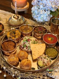 a platter filled with lots of different types of food on top of a table