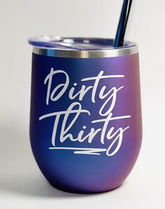 a purple and blue tumbler with the words dirty thirty written in white on it