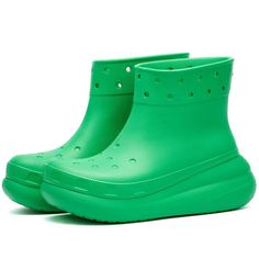 The iconic Crocs Classic Crush Rain Boot is elevated style for Instagrammers on-the-go. Its futuristic platform sole and charms keep your look fun whether dodging puddles or posting picturesque scenery. Croslite foam construction keeps feet lightweight and comfortable, while waterproof uppers and enhanced tread protect from rain and terrain. Add personalized flair with reversible ankle straps and countless Jibbitz charms to shine wherever your adventures lead. Green Synthetic Platform Boots, Green Platform Boots In Synthetic Material, Green Platform Boots With Synthetic Material, Casual Outdoor Platform Boots, Casual Green Platform Boots For Spring, Mega Crush Clog, Crocs Shoes Women, Moon Boots, Sporty And Rich