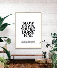 a poster with the words slow down, you're doing fine in black and white