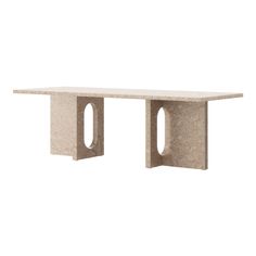 a table made out of concrete with two holes cut in the middle and one hole at the end