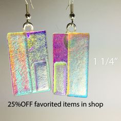 the earrings are made with iridescent foil and have square shaped rectangles