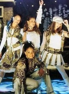 the girls are dressed in animal print outfits