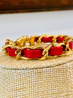 "Vintage gold tone chain link bracelet with red leather interwoven in the chain. It has a life preserver clasp. The bracelet is not signed but I am pretty sure this is J Crew. The bracelet measures 7\"." Red Metal Jewelry With Gold Chain, Red Gold Chain Metal Jewelry, Red Metal Chain Bracelet, Gold Vintage Leather Bracelet, Red Metal Bracelet With Adjustable Chain, Vintage J Crew, Life Preserver, Green Beaded Bracelets, I Am Pretty