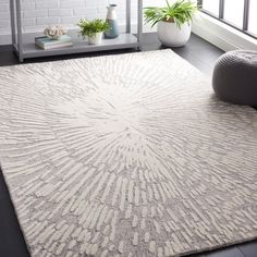 a white rug with an intricate design on it