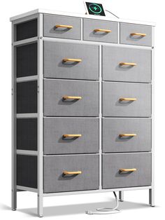 a large gray cabinet with drawers and wooden handles