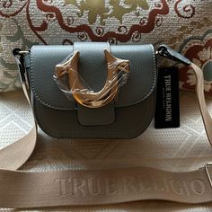 True Religion Crossbody Bag Nwt Trendy Crossbody Bag With Branded Hardware, Trendy Tan Crossbody Shoulder Bag, Tan Crossbody Shoulder Bag With Metal Hardware, Pink True Religion Hoodie, Bella Hadid True Religion, True Religion Purse, True Religion Jacket, Crossbody Shoulder Bag With Silver-tone Hardware, Silver-tone Hardware Crossbody Shoulder Bag