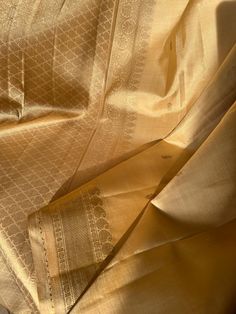 Gorgeous Golden Kancheevaram with golden zari  border and rich pallu.  Comes with gold tone silk blouse material. Pair it with golden blouse for a stunning monochromatic look or a contrast blouse to stand out. Elegant Formal Pre-draped Saree With Zari Weaving, Elegant Gold Anarkali Set With Dupatta, Gold Lehenga With Dupatta For Traditional Ceremonies, Gold Silk Lehenga For Wedding, Festive Gold Anarkali Set In Raw Silk, Festive Gold Raw Silk Anarkali Set, Festive Gold Silk Lehenga, Gold Raw Silk Anarkali Set For Wedding, Elegant Gold Raw Silk Lehenga