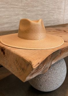 THE SUN-TANNED ORIGINAL RANCHER WITH A TRADITIONAL FIT... Crafted from 100% fine palm leaf straw, our hats boast an organic origin, making them not only environmentally friendly but also re-shapable, and water-shedding. The exceptional quality of our pure palm leaf hats is accentuated by their self-conforming feature, ensuring a personalized fit that effortlessly shapes to the contours of your head. Its easily moldable nature caters to the preferences of hat enthusiasts and milliners alike, addi Summer Fedora Panama Hat Made Of Palm Leaf, Natural Wide Brim Woven Fedora, Beige Woven Panama Hat With Curved Brim, Natural Woven Wide-brim Fedora, Beige Woven Straw Hat With Curved Brim, Beach Panama Hat In Beige Toquilla Straw, Eco-friendly Short Brim Hat For Vacation, Beige Toquilla Straw Fedora Panama Hat, Eco-friendly Lightweight Straw Hat For Vacation