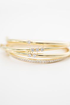 Introducing our 14K Diamond Bezel Bangle Bracelet - the perfect addition to your stack! Featuring a sleek bangle design and sparkling bezel diamonds, this bracelet adds an elegant touch to any outfit. 14K Yellow Gold | Diamonds Diamonds measure 3mm single 0.105 carat | duo 0.20 carat | trio 0.31 carat Measures 6.75 inches long Ethically made and sourced from India Bangle Design, Bangle Designs, Original Card, Bezel Diamond, Clean Beauty, Bangle Bracelet, Timeless Pieces, 6 Inches, Sale Items