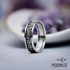 This Wide Silver Vintage Flourish Wedding Ring has a beautiful, curling design that is a wonderful compliment for everything from filigree to modern styles. The ring is finished with round Silver rails that accent and protect the pattern. This design has been a popular matching ring choice for couples. Sterling Silver Handmade Band Dimensions: Band Width - 6 mm wide, Band thickness - 1.5 mm Includes free resizing and 1 year warranty Spiral Sterling Silver Wedding Ring, Engraving Fonts, Matching Ring, Matching Rings, Handmade Silver, Wedding Ring, Modern Style, 1 Year, Ring Size