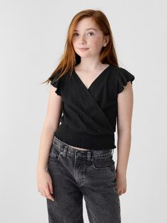 Soft cotton blend top.  V-neck.  Short flutter sleeves.  Wrap detail at front.  Smocked hem.  Slim fit.  Hits at the hip. Kids Wrap, Short Kings, Kids Wraps, Tool Band, Red Gloves, Women Skin, Reference Poses, Gap Kids