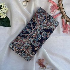 This Boho wallet is meticulously handcrafted using brocade fabric adorned with patterns reminiscent of traditional Turkish motifs, complemented by accents of vegan leather. Its allure and elegance are a testament to the classic Turkish design inspirations that grace both its front and back panels. Designed and meticulously crafted in Turkey, these wallets pay homage to the country's rich cultural heritage. Turkey is globally acclaimed for its vibrant history, stunning landscapes, and cultural di Blue Bohemian Clutch As A Gift, Bohemian Blue Clutch As Gift, Bohemian Blue Clutch For Gifts, Blue Bohemian Clutch Gift, Elegant Multicolor Clutch Wallet, Multicolor Clutch Wallet With Card Slots, Multicolor Clutch With Card Slots For Daily Use, Vintage Multicolor Wallet For Daily Use, Multicolor Clutch With Card Slots As Gift