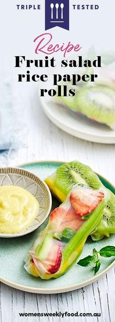 fruit salad rice paper rolls on a plate with dipping sauce in the middle and two plates behind them