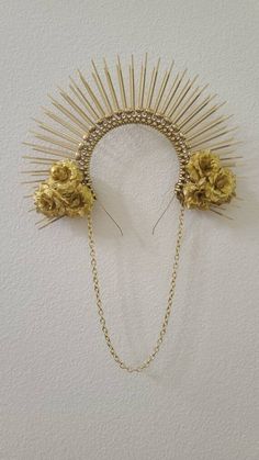 Dress up your tresses with this comfy and lightweight crown. It features gold faux flowers, gold beads, and crystal rhinestones.  To finish it off, this crown also features a gold chain.  Perfect for the holidays, festivals and galas.  This crown is made out of zip ties attached to a metal headband. One size fits all. ༓❈ Made in USA ❈༓ Hispanic Makeup, Halo Crown, Metal Headband, Fantasy Wedding, Metal Headbands, Golden Jewelry, Flower Headpiece, Zip Ties, Gold Flower