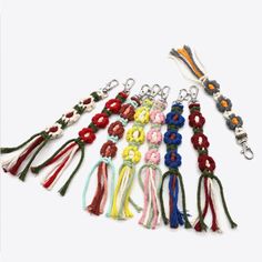 a bunch of lanyards with different colors and designs