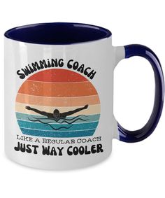 a white and blue coffee mug with swimming coach like a regular coach just way cooler