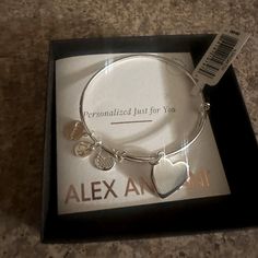 Alex And Ani Silver Bangle Bracelet With Heart Charm. Brand New. Never Worn. Still In Box. Bracelet Is Adjustable Nickel-free Bracelets For Valentine's Day, Adjustable Heart Charm Bracelet For Anniversary, Valentine's Day Nickel Free Charm Bracelet, Heart-shaped Charm Bracelet For Personalized Gift, Metal Heart Bangle Bracelet For Anniversary, Metal Heart Bangle For Anniversary, Heart Charm Bracelet For Personalized Gift, Personalized Heart Charm Bracelet Gift, Adjustable Silver Heart Bracelet Gift