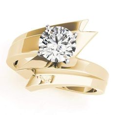 a yellow gold ring with a diamond on it