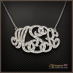 Personalized gold and diamond monogram necklace 1.0 inch high, 1.5 wide and about 1mm thick, made of solid 14kt. white gold and has a total of 0.80ct. in diamonds. The necklace suspends from a cable Link chain with 3 choices of length: 14,16 and 18. The Monogram can be made with the initials of your Elegant White Monogram Jewelry, Luxury White Gold Necklace With Hallmarks, Luxury Silver Necklace With Hallmarks, White Diamond Initial Pendant Necklace, White Diamond Initial Pendant Necklace As Gift, Elegant Personalized Diamond White Jewelry, Personalized Elegant Sterling Silver Diamond Necklace, White Diamond Necklace With Initial Pendant, Elegant Personalized Sterling Silver Diamond Necklace