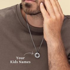 "Introducing our stunning personalized men's circle necklace, a heartfelt piece designed to celebrate the joy of fatherhood. Handcrafted with love and attention to detail, this heirloom-quality necklace features a sleek circular pendant, adorned with the names of your beloved children. Each name is delicately engraved, creating a unique and meaningful keepsake. Made from premium stainless steel, this necklace is both durable and stylish, making it the perfect accessory for everyday wear. Give th Customized Sterling Silver Necklace For Father's Day, Customizable Round Pendant Necklace For Father's Day, Customized Round Pendant Necklace For Father's Day, Father's Day Engraved Adjustable Necklace, Stainless Steel Round Pendant Necklace For Father's Day, Personalized Name Necklace For Father's Day, Father's Day Custom Name Sterling Silver Necklace, Adjustable Stainless Steel Necklaces For Father's Day, Personalized Dog Tag Necklaces For Father's Day