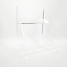 a clear acrylic display case on a white background with no one around it