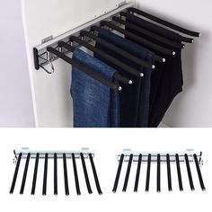 clothes hangers are hanging on the side of a wall and two pairs of jeans