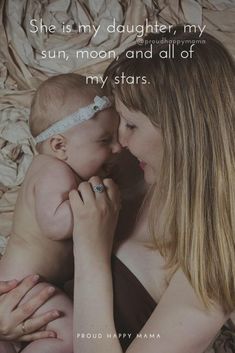 a woman holding a baby in her arms with the caption she is my daughter, my sun, moon and all of my stars